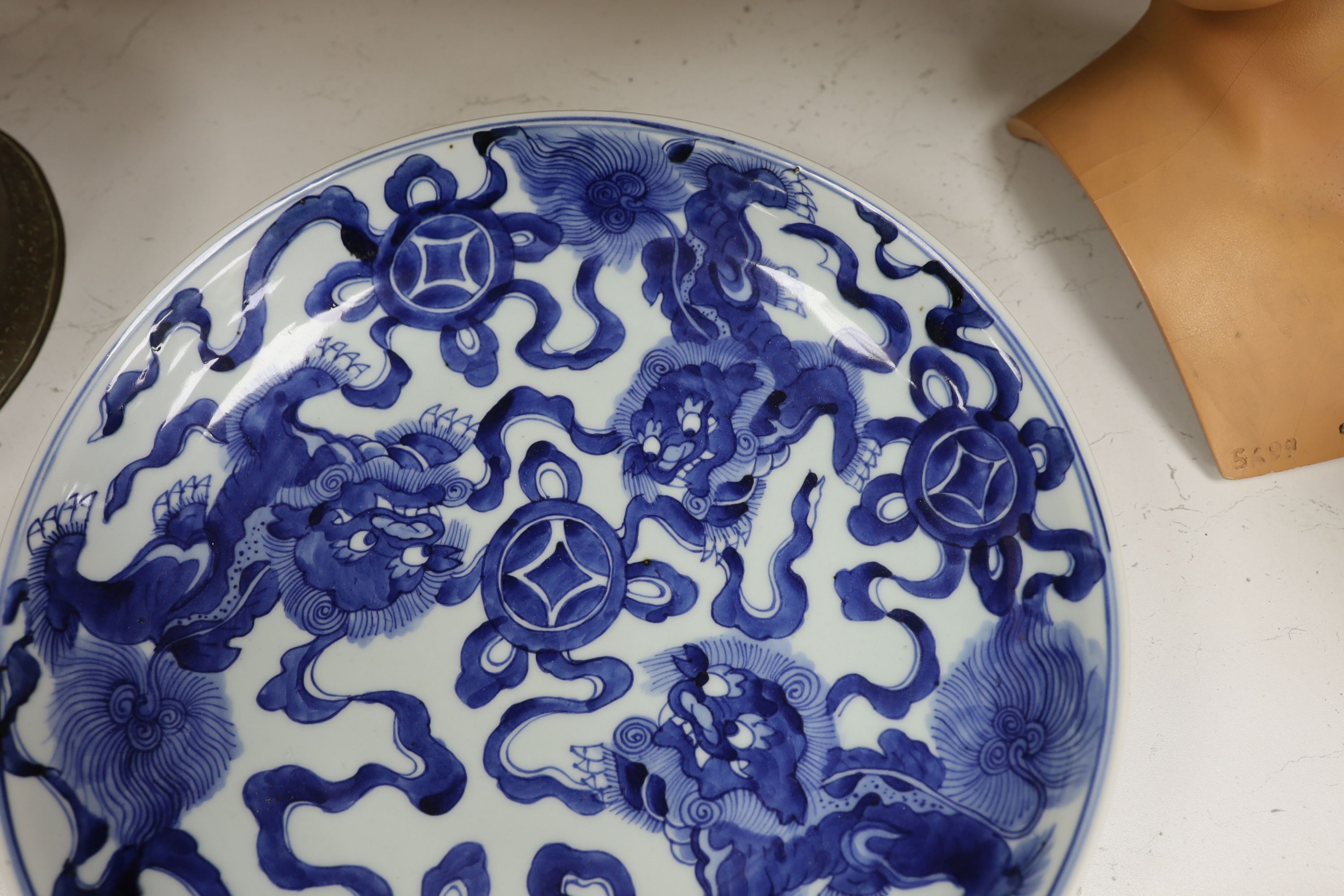 A Chinese blue and white ‘Buddhist lion’ dish, channel moulded foot, 36cm diameter